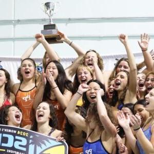 The Pomona-Pitzer women's swim team cheer 和 raise up the SCIAC trophy.
